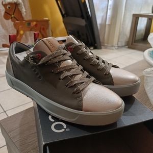 Ecco. Gray and gold golf shoes